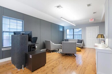 Living room with light wood-style floors and base