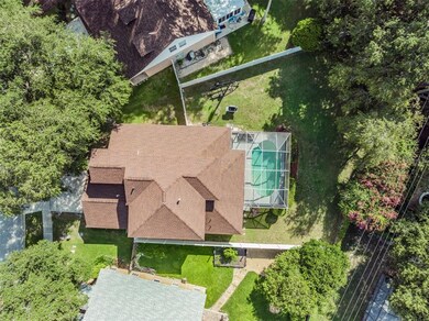 aerial view- newer roof, pool and large fenced in 