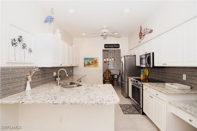 White cabinets and recessed lighting makes for a b