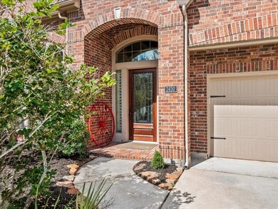 As you approach the home, you're greeted by a 8' front door and grand entrance surrounded by lush and mature landscaping.  Live Oak Trees give great shade to the front yard and the front of the home.