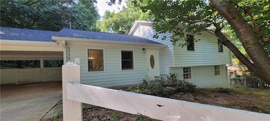 View of front facade with roof with shingles