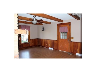 Hearth room with fireplace and wood flooring measu