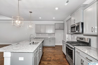 Picture of similar plan; kitchen will have gas cooktop and wall microwave and oven