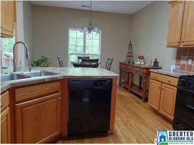View in kitchen; notice the 'goose neck' faucet an