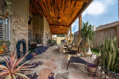 Covered Porch with Flagstone Decking in Backyard