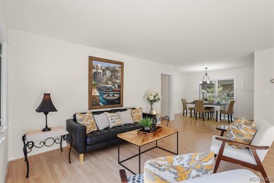 Living Room with Laminate Floors.  Open to the Din