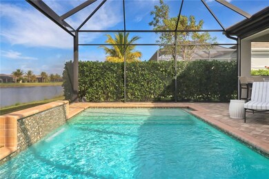 View of pool with a lanai, a patio, and a water vi