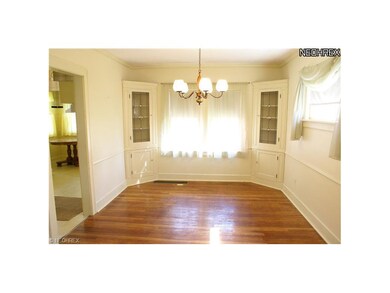 Dining room with built in china cabinets with lead