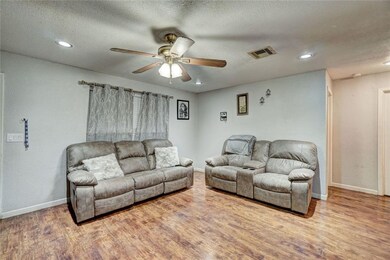 Good size living area with wood look laminate floo
