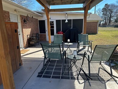 View of patio featuring a grill