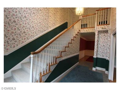 Foyer - The foyer has wide stairs, cost closet, an