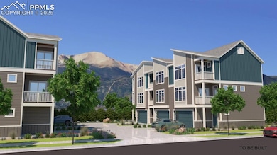 View of property featuring a garage, a mountain vi