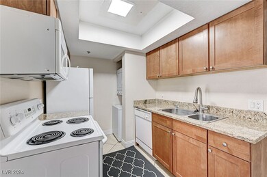 Kitchen with brown cabinets, light tile patterned