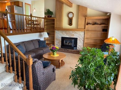 Main floor living room with gas fireplace.