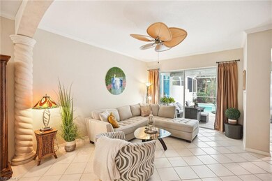 Entryway featuring light tile patterned floors, french doors, and ornamental molding
