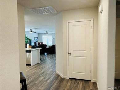 Hall featuring dark wood-type flooring