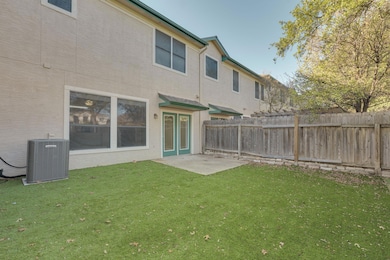 Rear view of property featuring a patio area and a fenced backyard