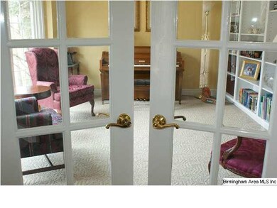French doors with transom, located off the foyer, 