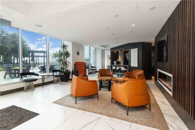 Common area featuring expansive windows and recessed lighting