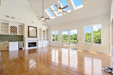 Unfurnished living room featuring high vaulted cei