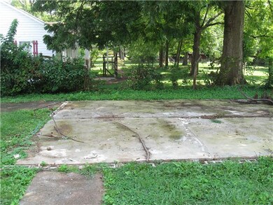 There is a large concrete slab in the backyard that could hold a metal building, storage barn or be a great shady patio for grilling and entertaining.