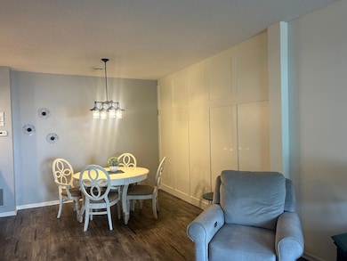Dining area with contempory paneled wall