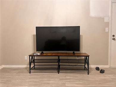 Detailed view of wood finished floors and baseboards