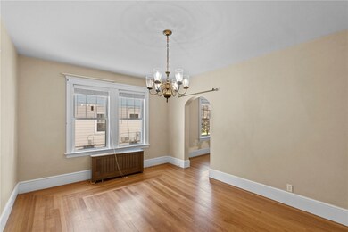 formal dining room with gleaming hardwoods