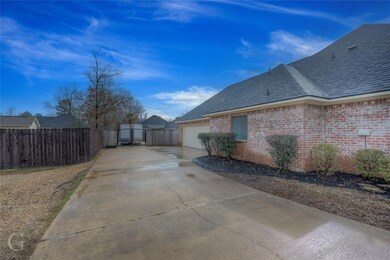 Driveway leading to garage/Side of home