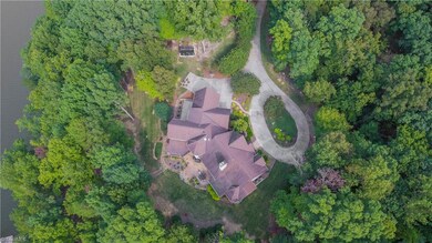 Aerial showing private setting of this lakefront home