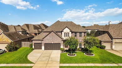 3 car garage each driveway with a large front lawn