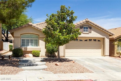 Mediterranean / spanish-style home with an attache