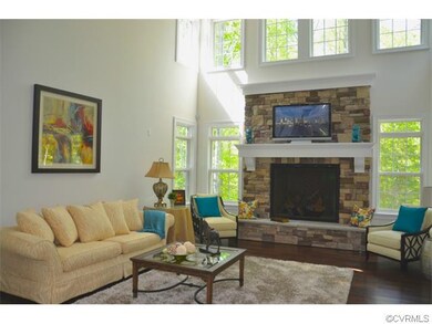 Two story family room with stone gas fireplace, ha