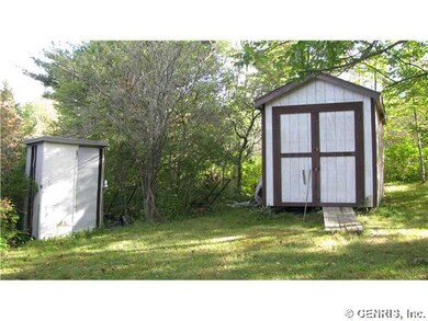 Outbuilding. Two sheds in back yard.