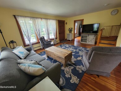 Living toward front porch & front bedroo
