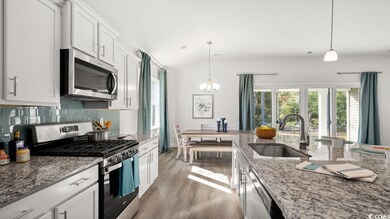 Kitchen featuring a sink, stainless steel applianc