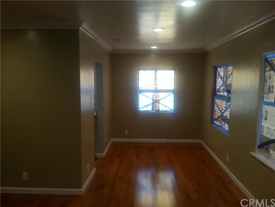 Looking into the dining room where hardwood floors