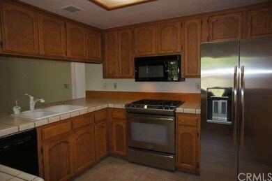 Newer stainless steel appliances in kitchen.  Frid
