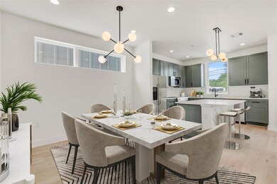 Dining room featuring a chandelier, light wood-st
