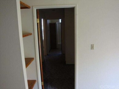 Hallway to three bedrooms and bathrooms