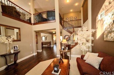 Dramatic entry with hard wood flooring 
