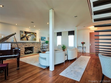 Another view of living area, cozy fireplace.