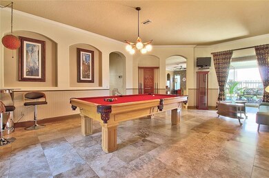 The entry-way and Living Room boast Travertine til