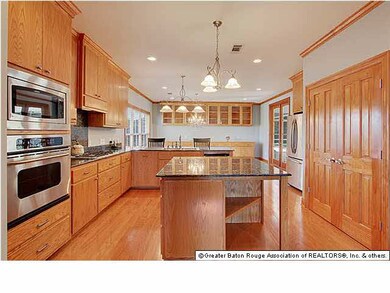 Kitchen with stainless appliances, slab granite co