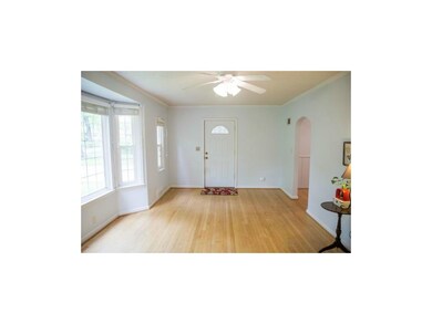 Front door opens to spacious living room.