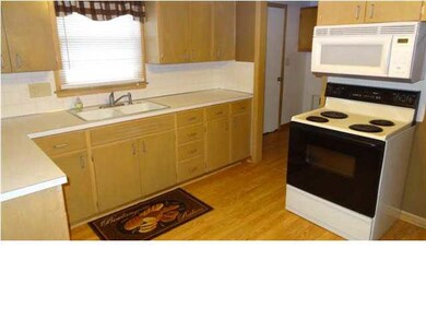 Kitchen has lots of cabinets.