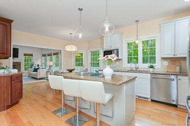 Island with breakfast bar seating.