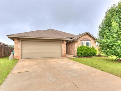 Single story home with brick siding, driveway, an attached garage, and roof with shingles