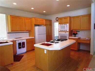 Gourmet kitchen with center island and built in de
