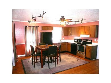 Kitchen. Hardwood floor, newer lighting & ceiling 
